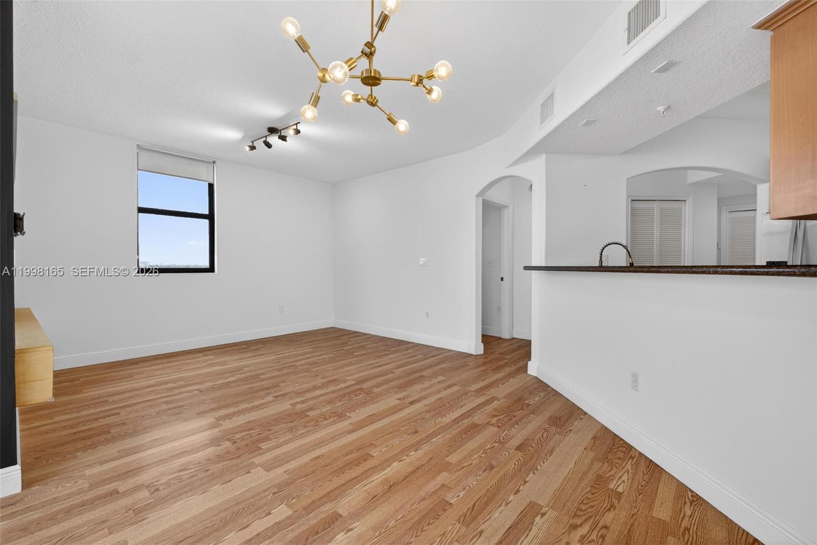 2301 Southwest 27th Avenue, Unit 906 Miami, FL 33145 - Photo 15 of 38 a view of a livingroom with a kitchen