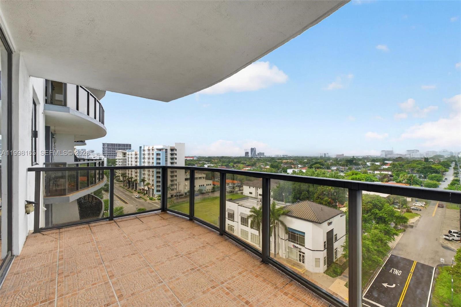 2301 Southwest 27th Avenue, Unit 906 Miami, FL 33145 - Photo 19 of 38 a view of a balcony with city view