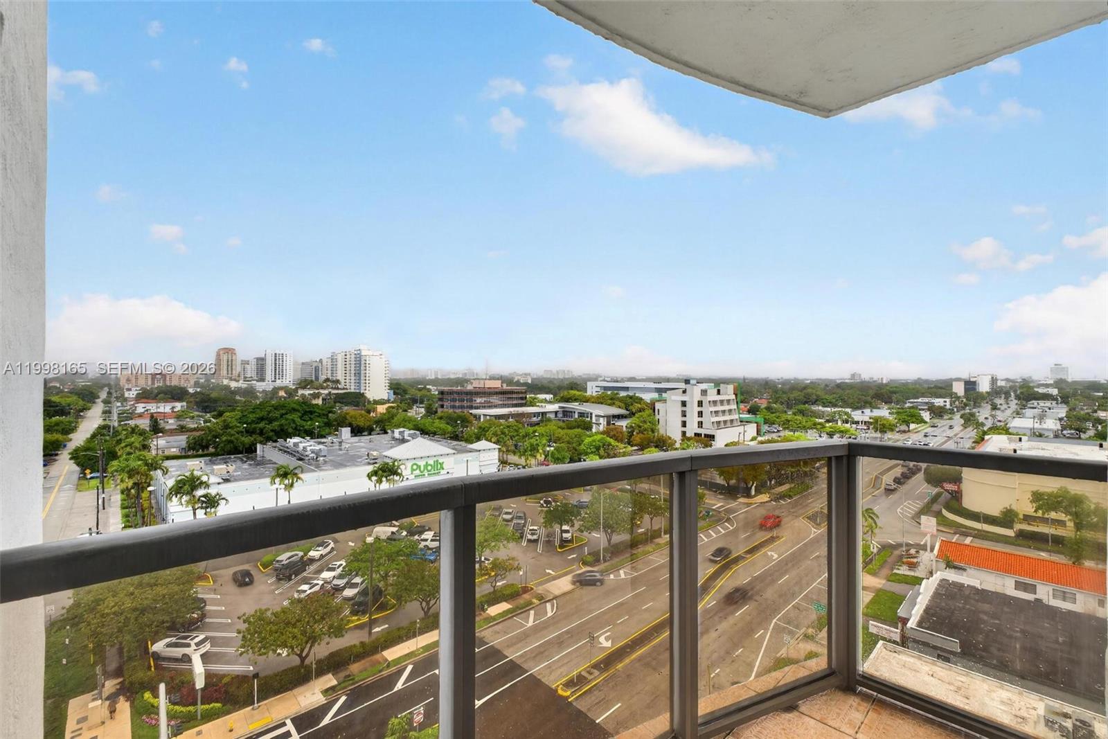 2301 Southwest 27th Avenue, Unit 906 Miami, FL 33145 - Photo 30 of 38 a view of a city skyline from a balcony