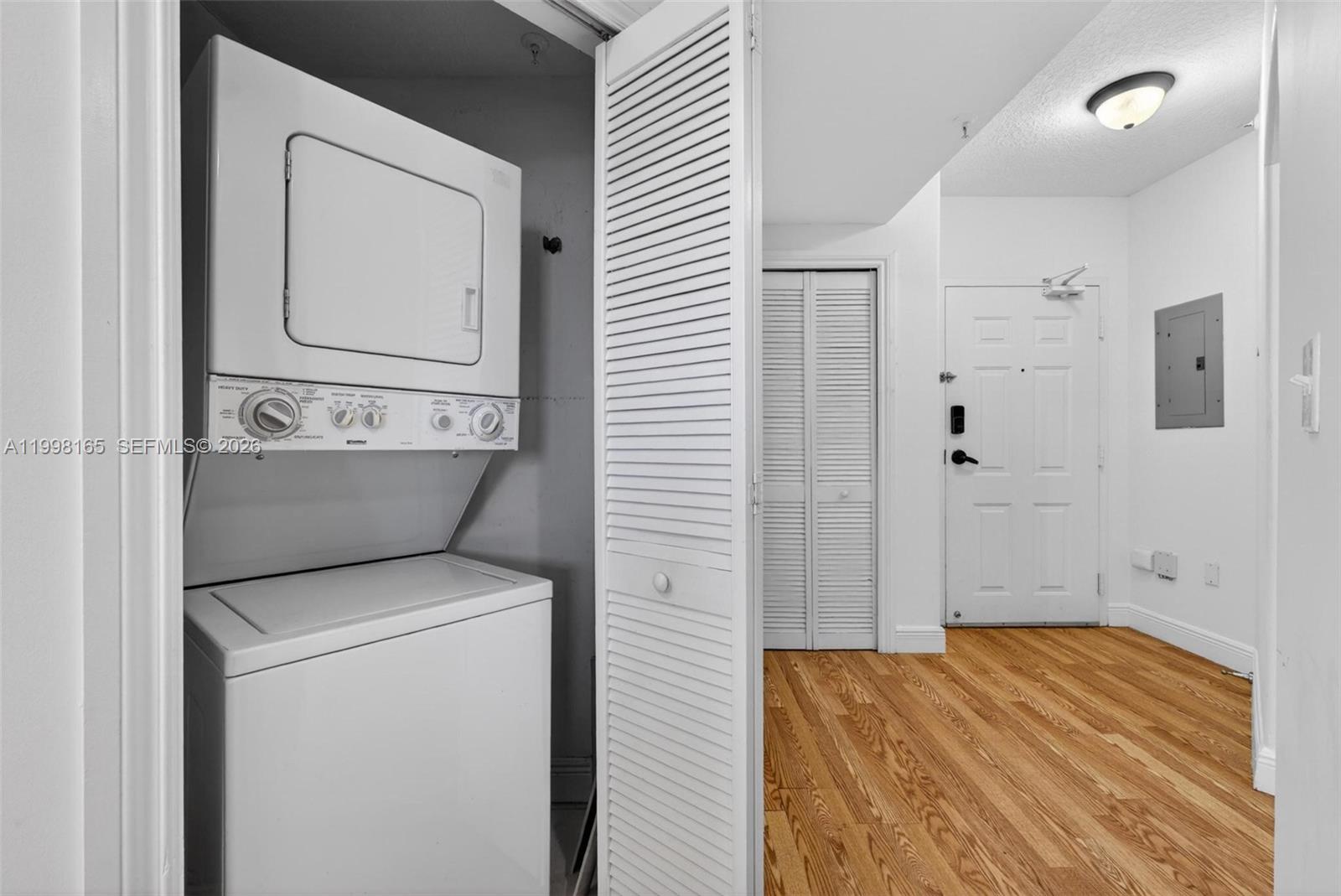 2301 Southwest 27th Avenue, Unit 906 Miami, FL 33145 - Photo 8 of 38 a view of bathroom and utility room