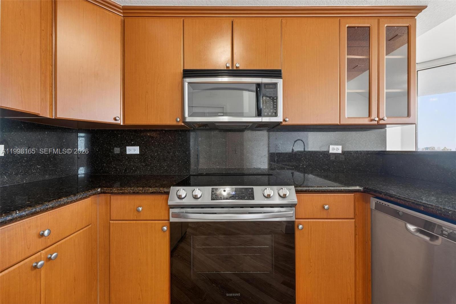 2301 Southwest 27th Avenue, Unit 906 Miami, FL 33145 - Photo 10 of 38 a kitchen with a sink and a washing machine