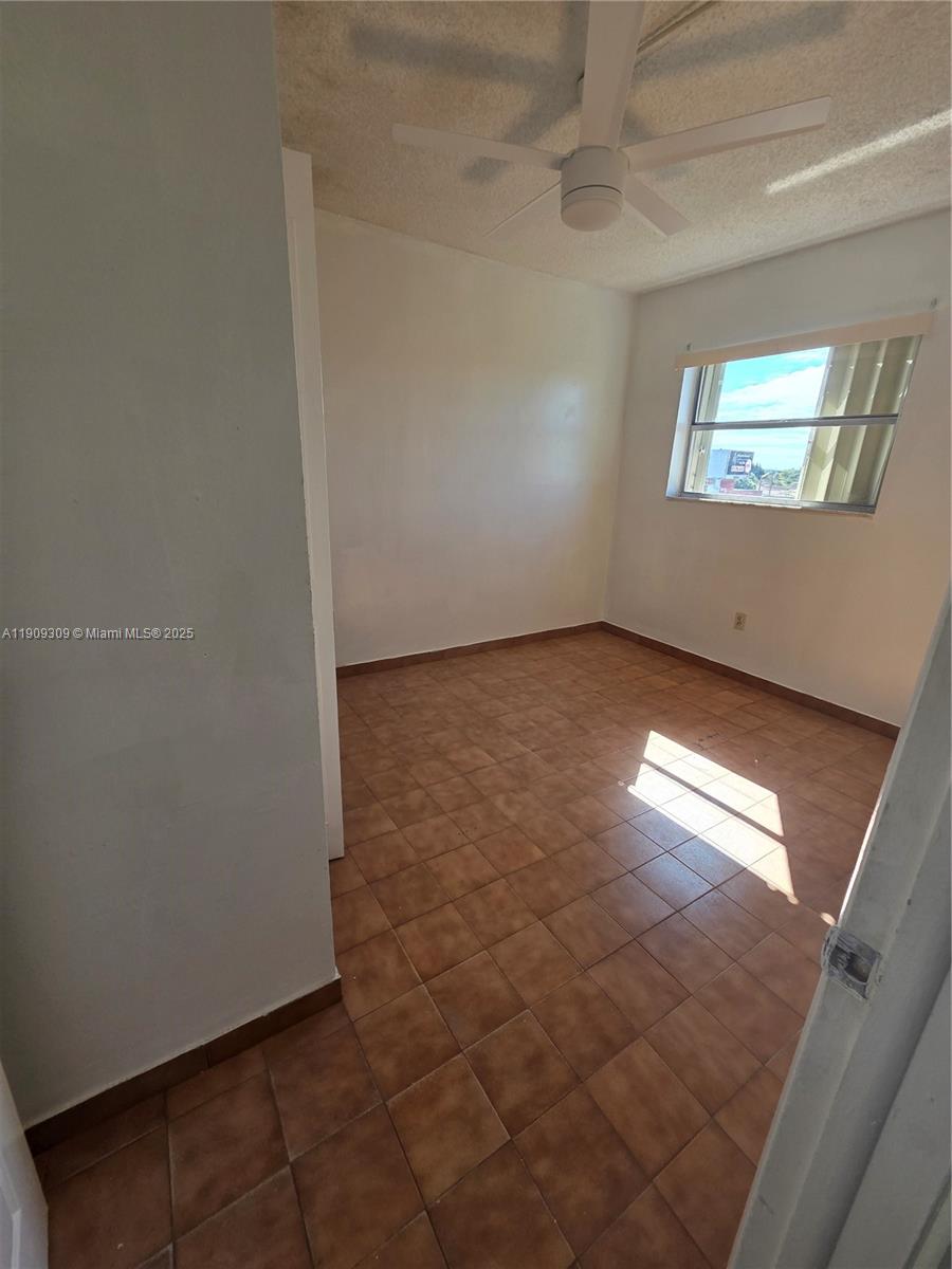 3640 Northwest 9th Street, Unit 407 Miami, FL 33125 - Photo 14 of 24 an empty room with windows