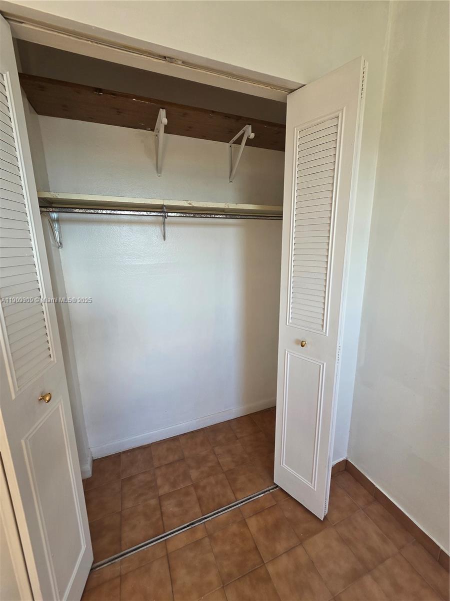 3640 Northwest 9th Street, Unit 407 Miami, FL 33125 - Photo 15 of 24 a view of an empty walk in closet