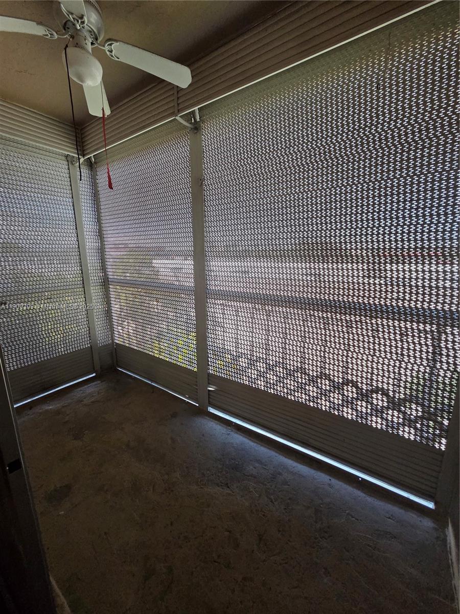 3640 Northwest 9th Street, Unit 407 Miami, FL 33125 - Photo 2 of 24 a view of an empty room with a window