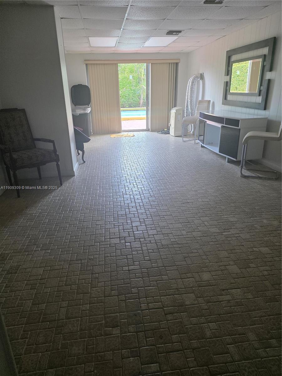 3640 Northwest 9th Street, Unit 407 Miami, FL 33125 - Photo 23 of 24 a view of livingroom with furniture and windows