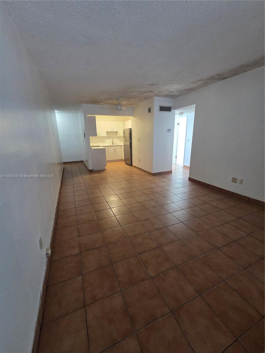 3640 Northwest 9th Street, Unit 407 Miami, FL 33125 - Photo 3 of 24 a view of a livingroom with a fireplace