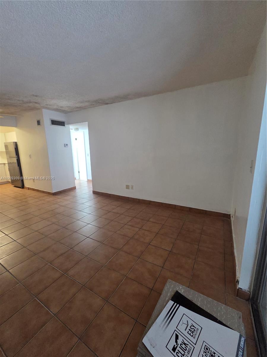 3640 Northwest 9th Street, Unit 407 Miami, FL 33125 - Photo 5 of 24 a view of an empty room and a window
