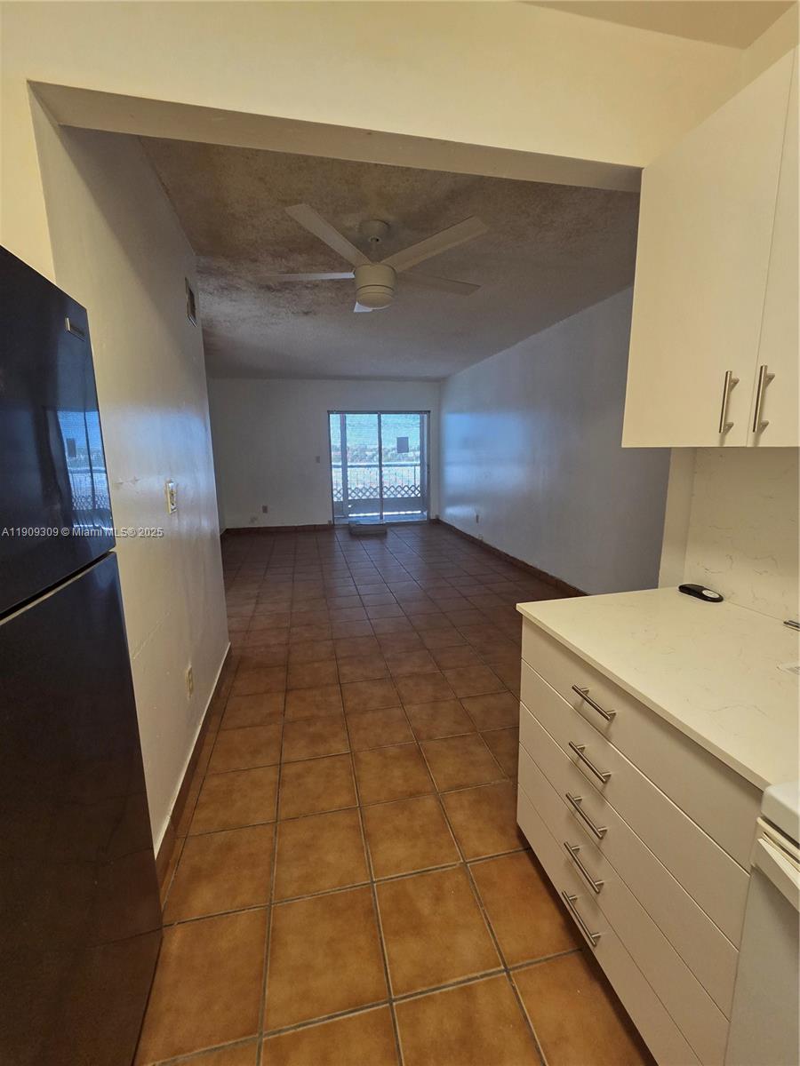 3640 Northwest 9th Street, Unit 407 Miami, FL 33125 - Photo 7 of 24 a kitchen with a stove
