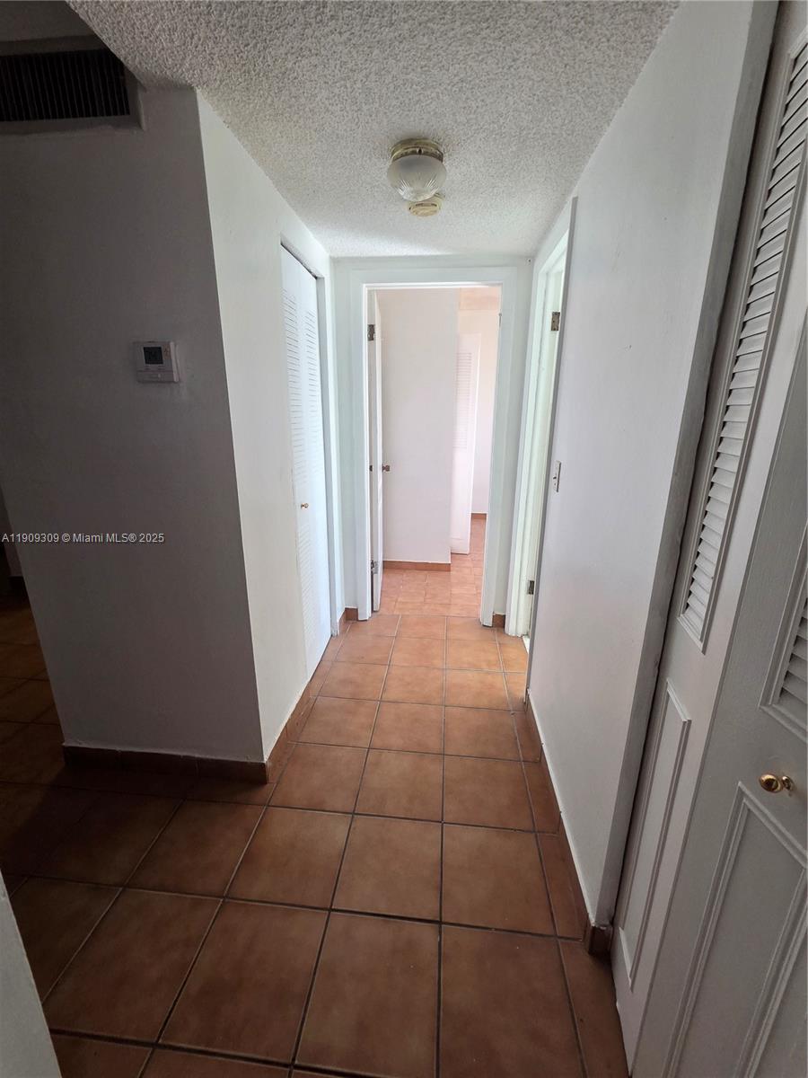 3640 Northwest 9th Street, Unit 407 Miami, FL 33125 - Photo 9 of 24 a view of a hallway