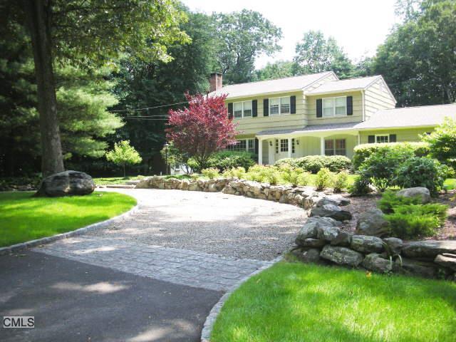 35 Cavalry Hill Road Wilton, CT 06897 - Photo 1 of 1 a front view of house and yard with green space