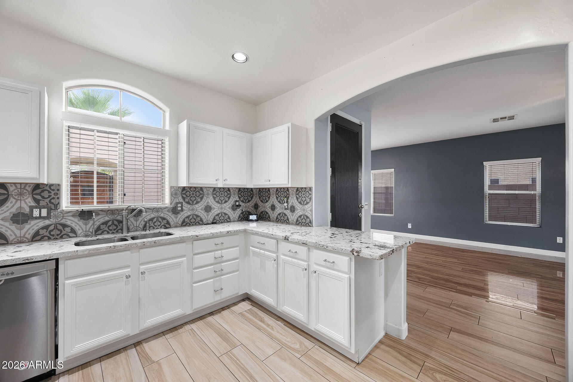 608 West Gary Way Phoenix, AZ 85041 - Photo 22 of 48 a kitchen with a sink cabinets and window