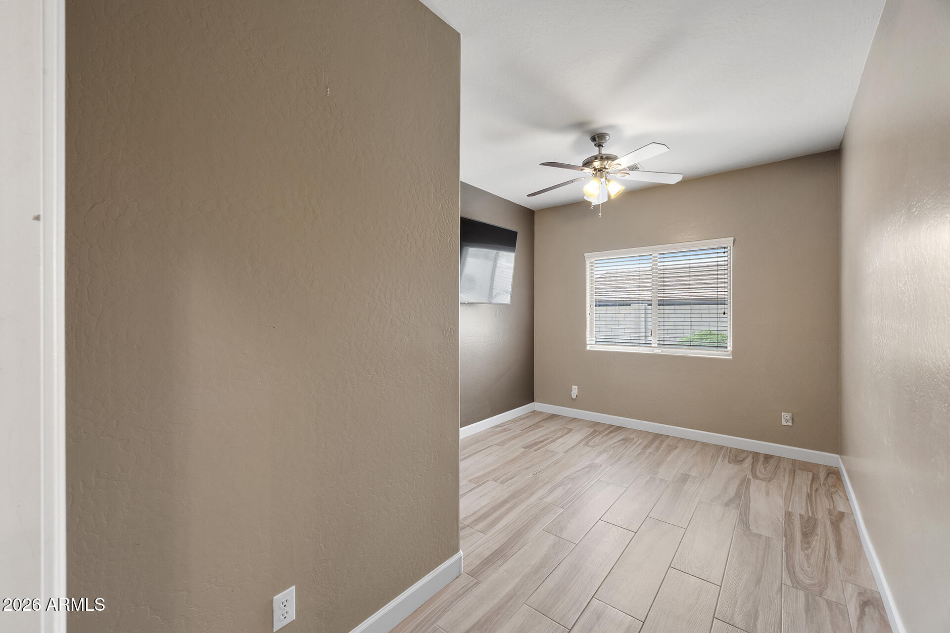 608 West Gary Way Phoenix, AZ 85041 - Photo 29 of 48 a view of an empty room with a window