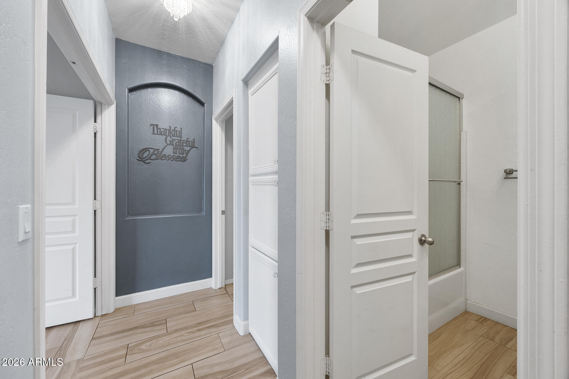 608 West Gary Way Phoenix, AZ 85041 - Photo 31 of 48 a view of a hallway with wooden floor and entryway