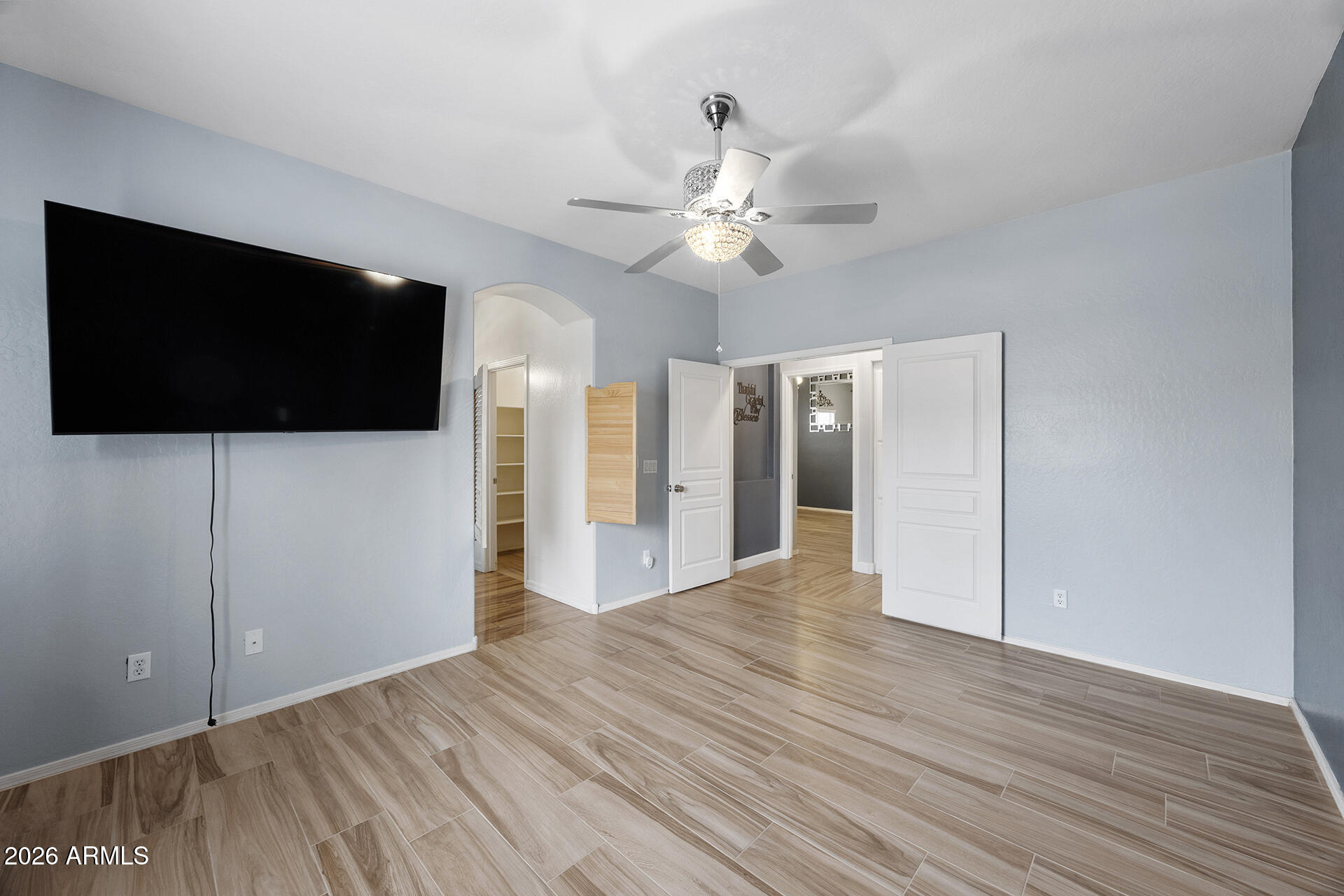 608 West Gary Way Phoenix, AZ 85041 - Photo 37 of 48 a view of a livingroom with wooden floor