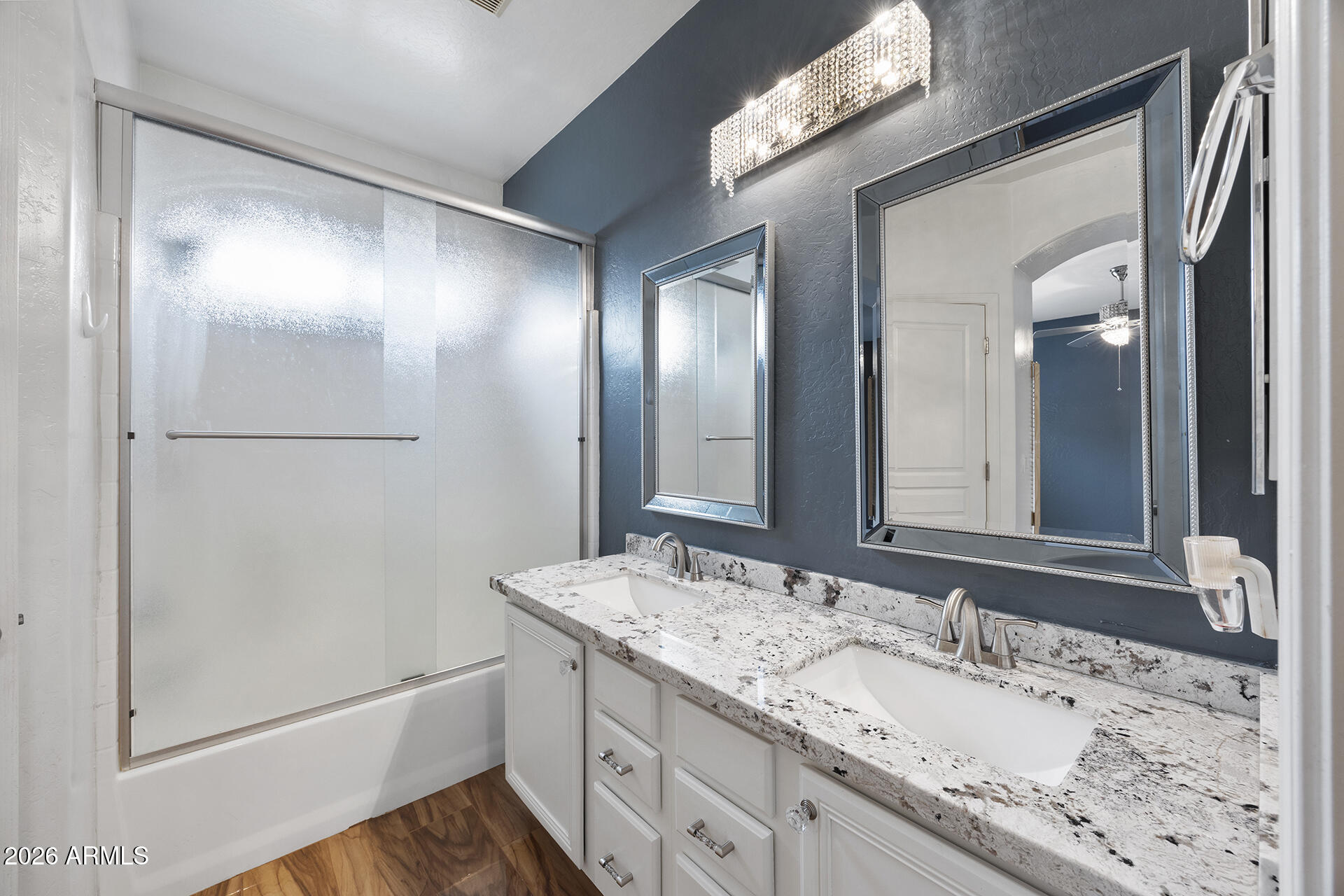 608 West Gary Way Phoenix, AZ 85041 - Photo 38 of 48 a bathroom with a granite countertop sink and a mirror