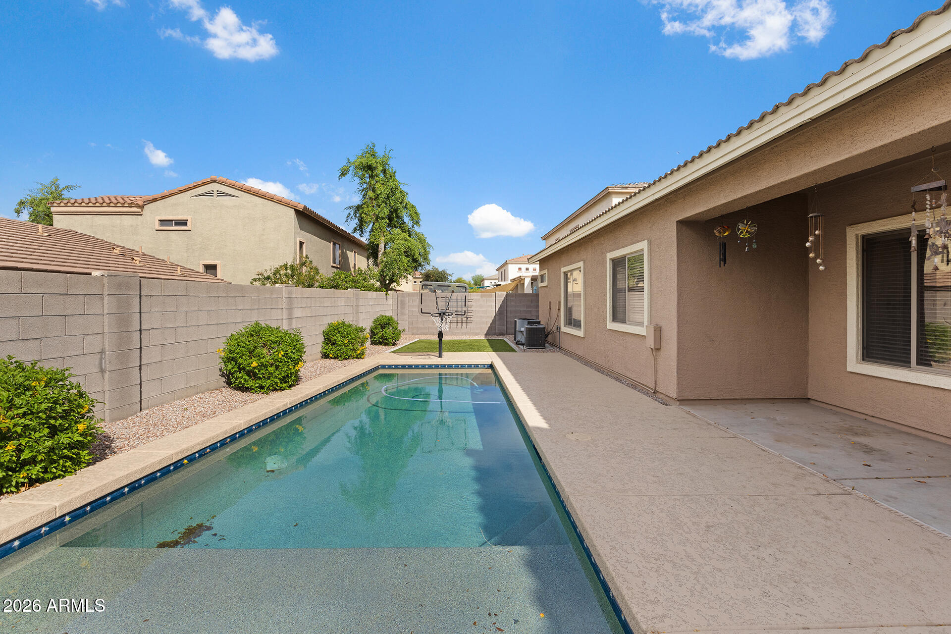 608 West Gary Way Phoenix, AZ 85041 - Photo 43 of 48 a view of a house with a swimming pool
