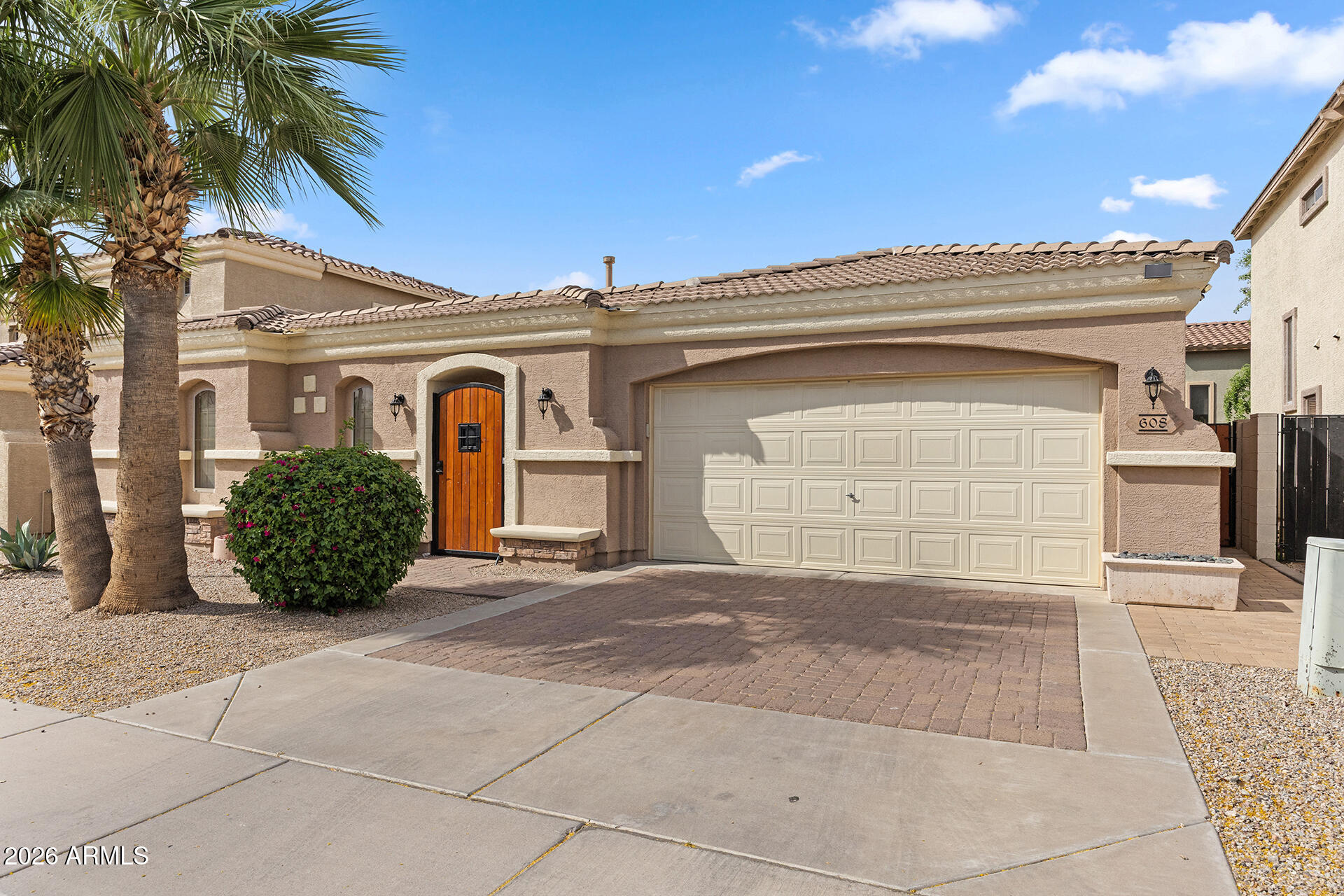 608 West Gary Way Phoenix, AZ 85041 - Photo 5 of 48 a front view of a house with a garage