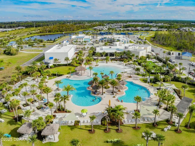 an aerial view of a pool patio swimming pool and outdoor seating