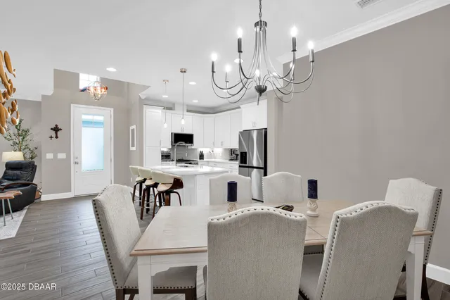 a view of kitchen and dining area with furniture