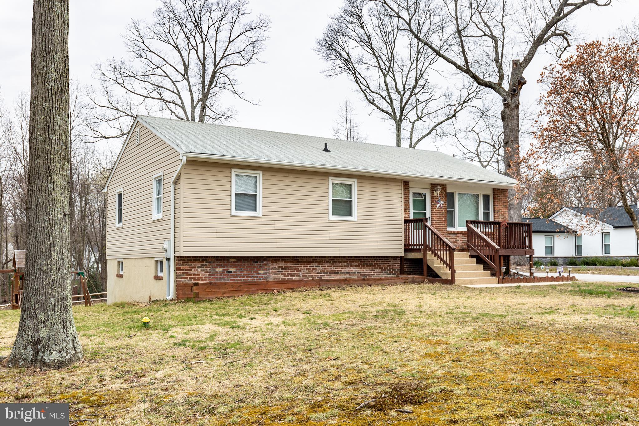8240 WB&A Road Severn, MD 21144 - Photo 5 of 43 a view of a house with a yard chairs and a tree