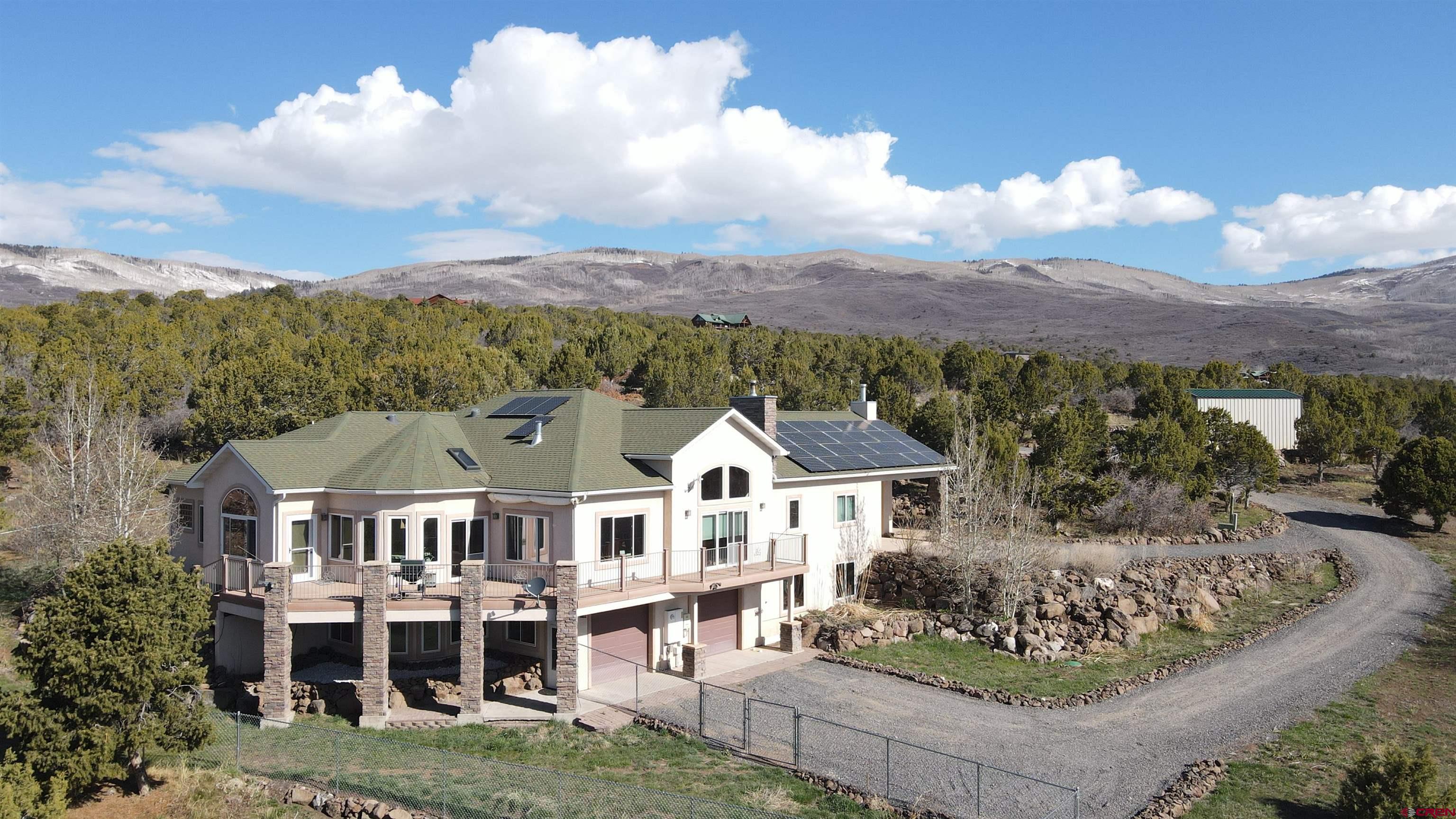 21602 Standingbear Road Cedaredge, CO 81413 - Photo 1 of 35 an aerial view of a house