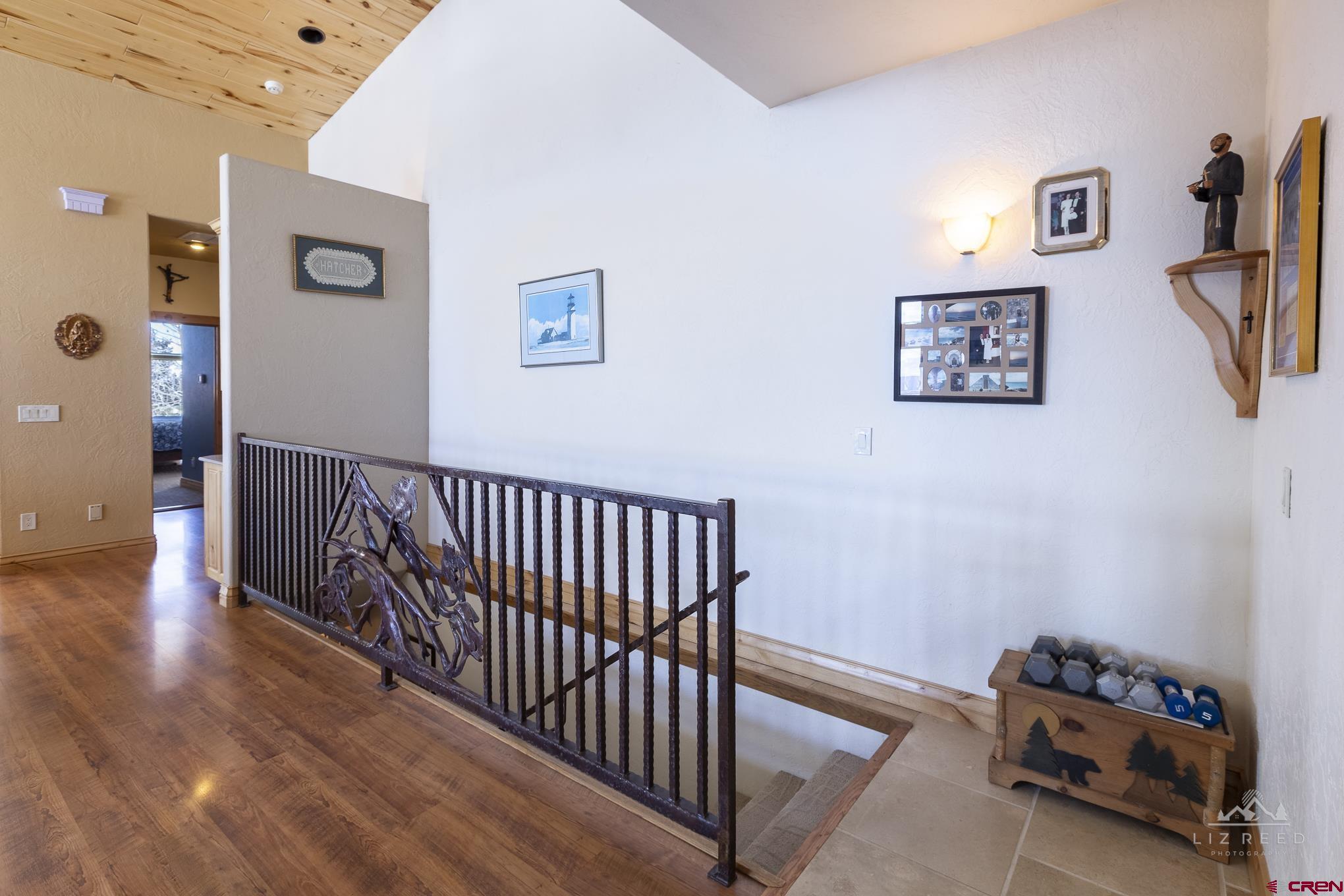 21602 Standingbear Road Cedaredge, CO 81413 - Photo 15 of 35 a view of a hallway with workspace