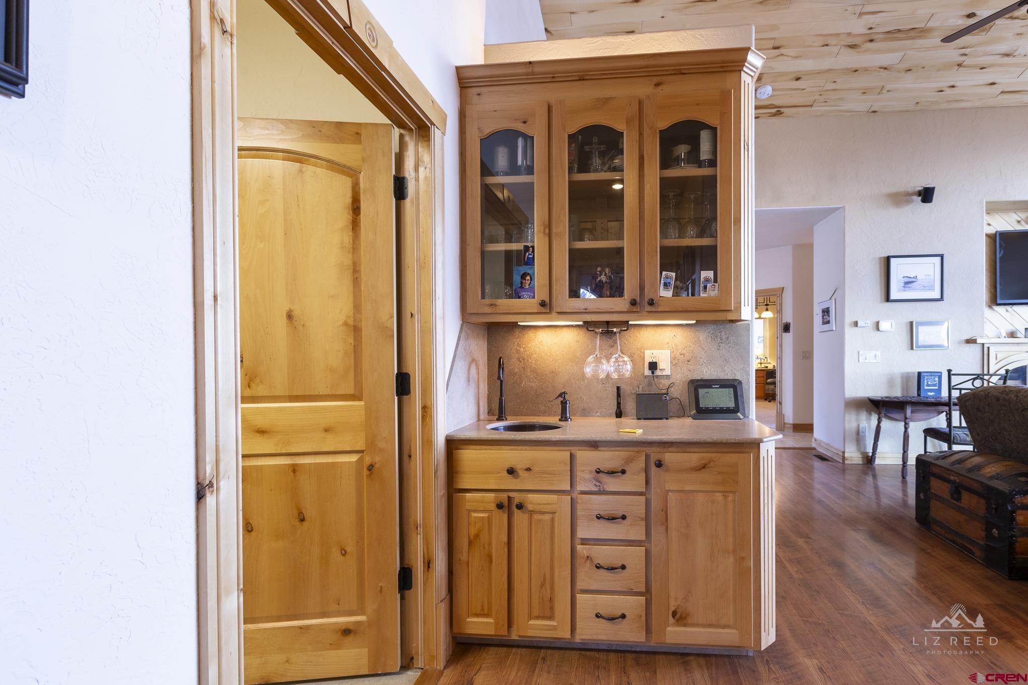 21602 Standingbear Road Cedaredge, CO 81413 - Photo 22 of 35 a view of kitchen with wooden floor