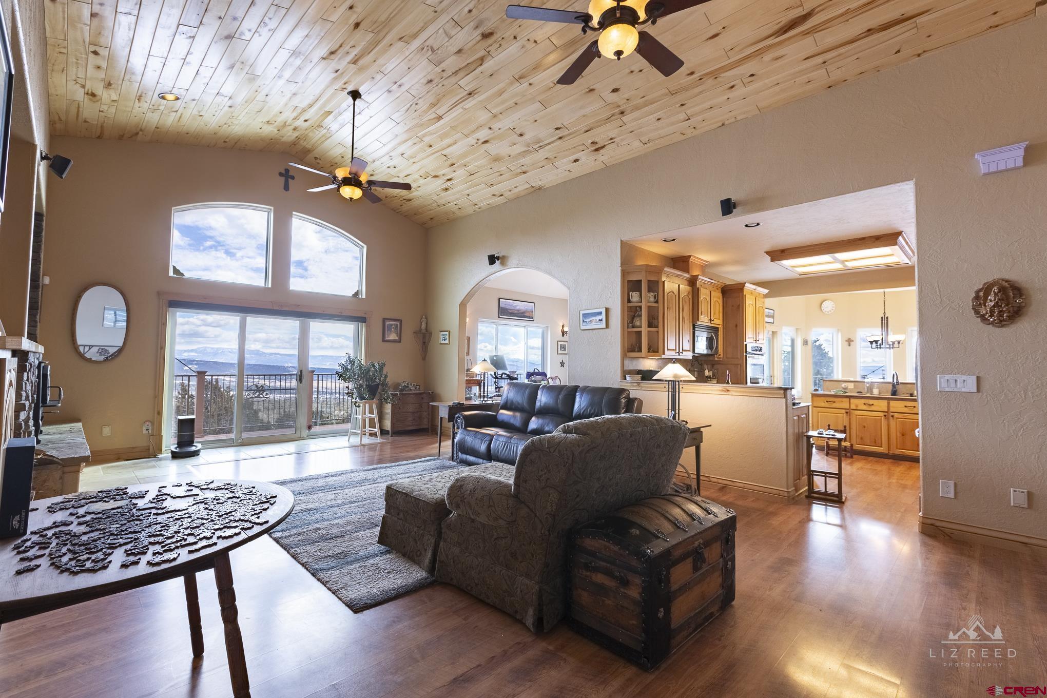 21602 Standingbear Road Cedaredge, CO 81413 - Photo 28 of 35 a living room with furniture and wooden floor