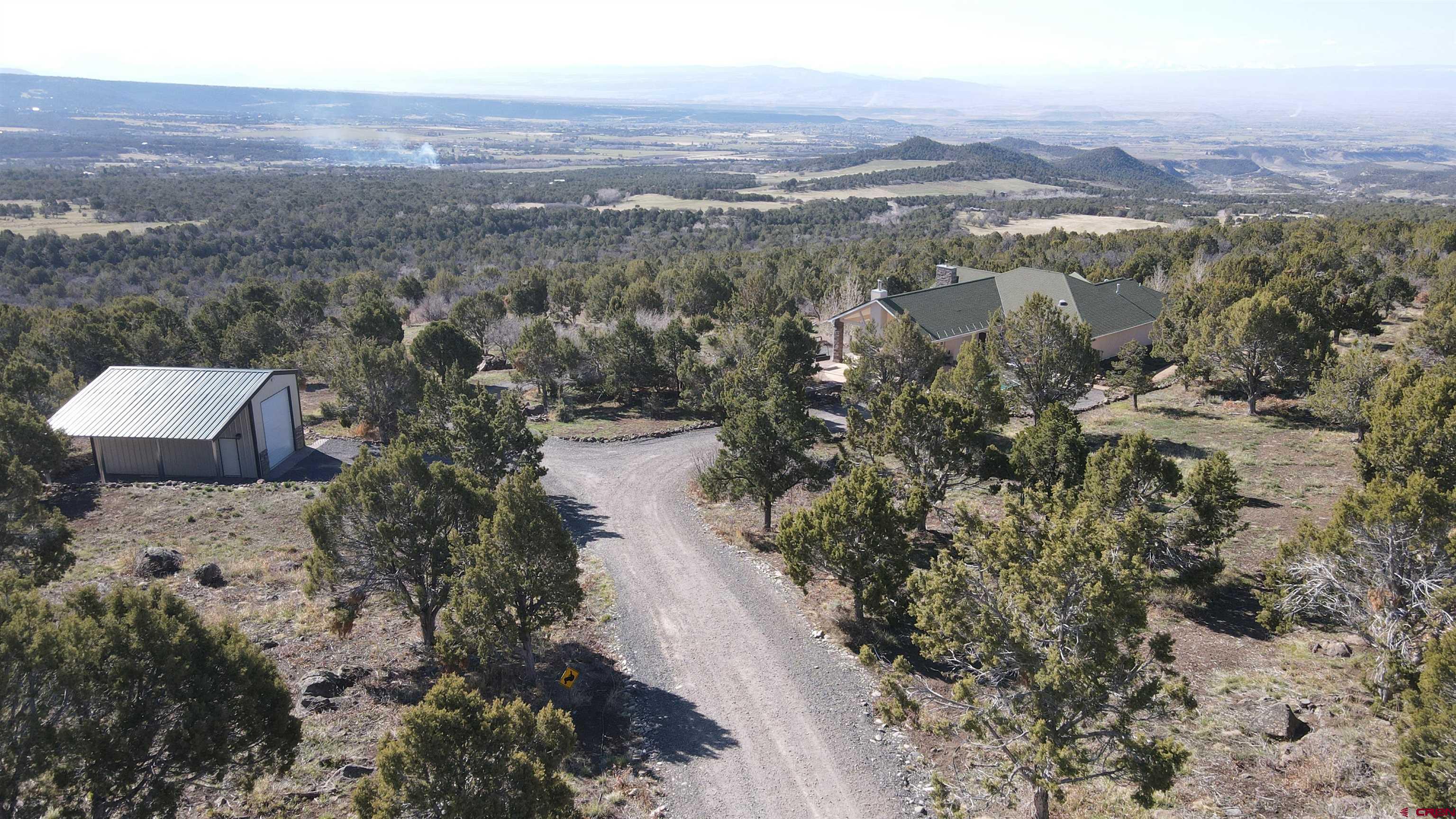 21602 Standingbear Road Cedaredge, CO 81413 - Photo 3 of 35 view of city and mountain