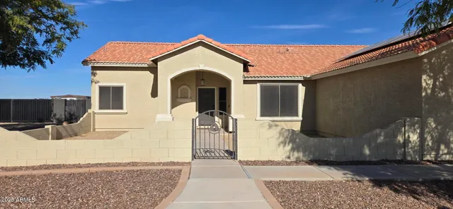 a room with furniture pool table and chairs
