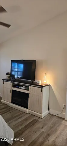 a bedroom with a bed and a stove