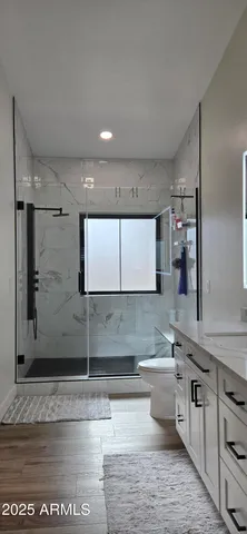 a view of a yard with snow on the road