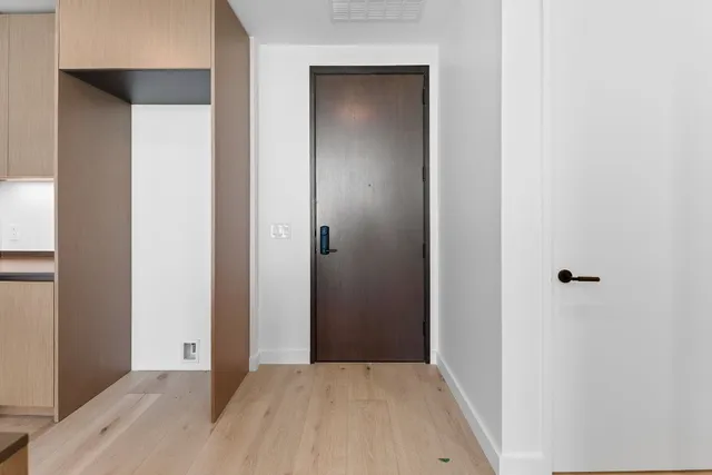 a view of a small space with wooden floor