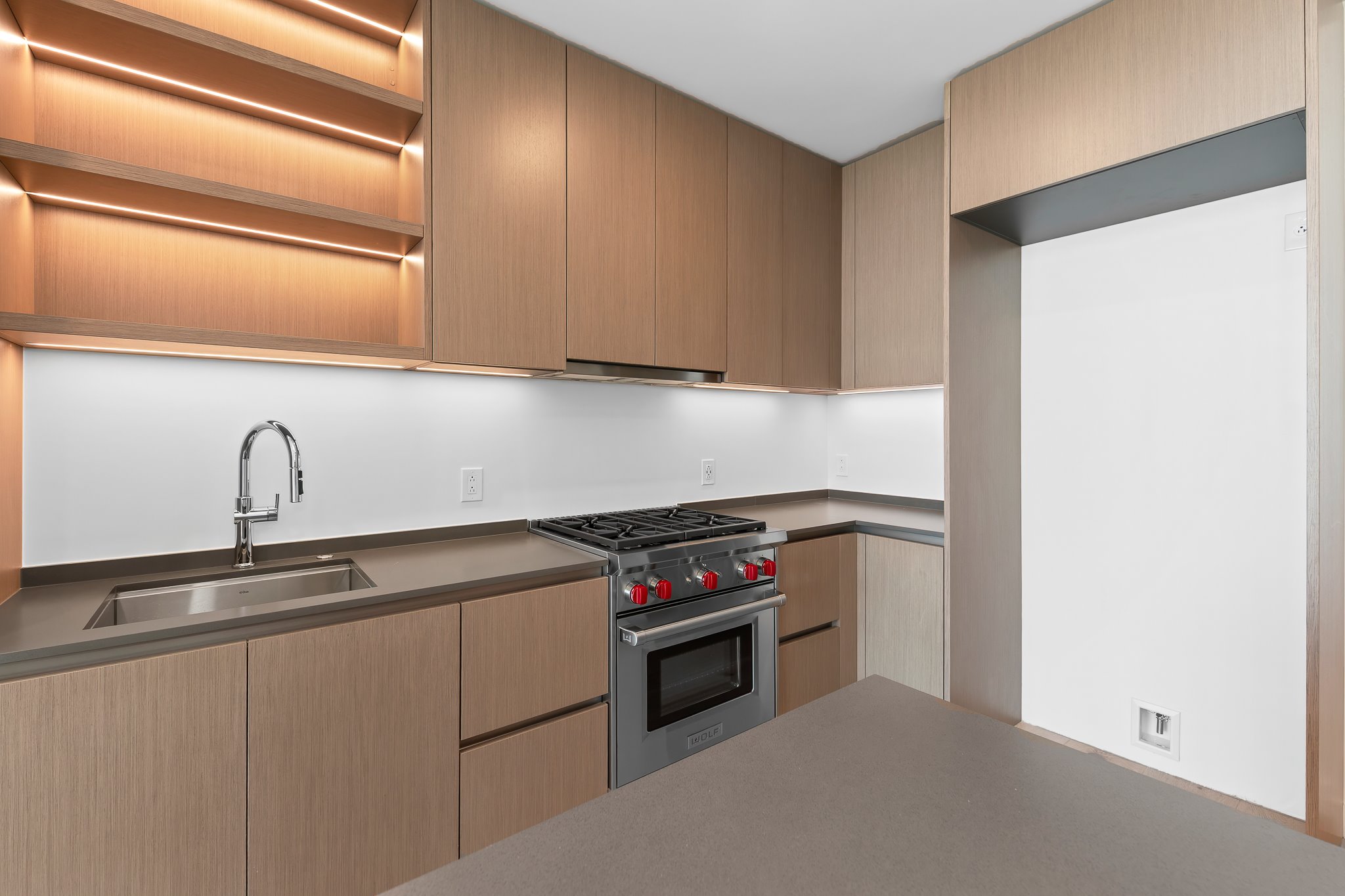 610 Davis Street, Unit 5206 Austin, TX 78701 - Photo 26 of 35 a kitchen with stainless steel appliances granite countertop a sink and a stove