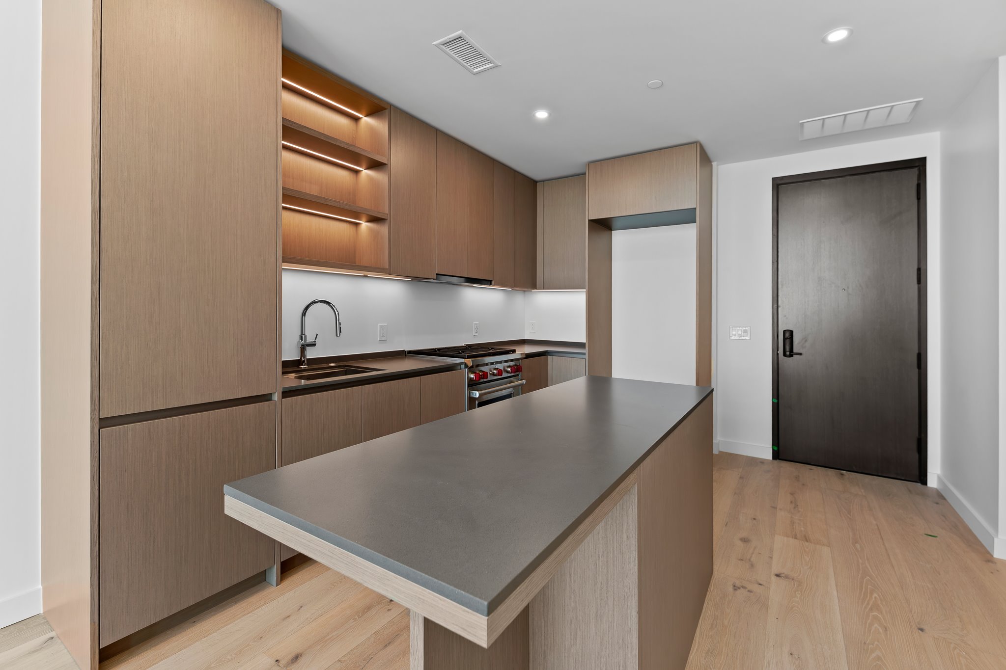 610 Davis Street, Unit 5206 Austin, TX 78701 - Photo 4 of 35 a kitchen with stainless steel appliances a refrigerator and a stove