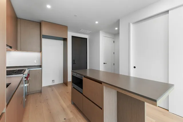 a kitchen with stainless steel appliances a refrigerator and a stove