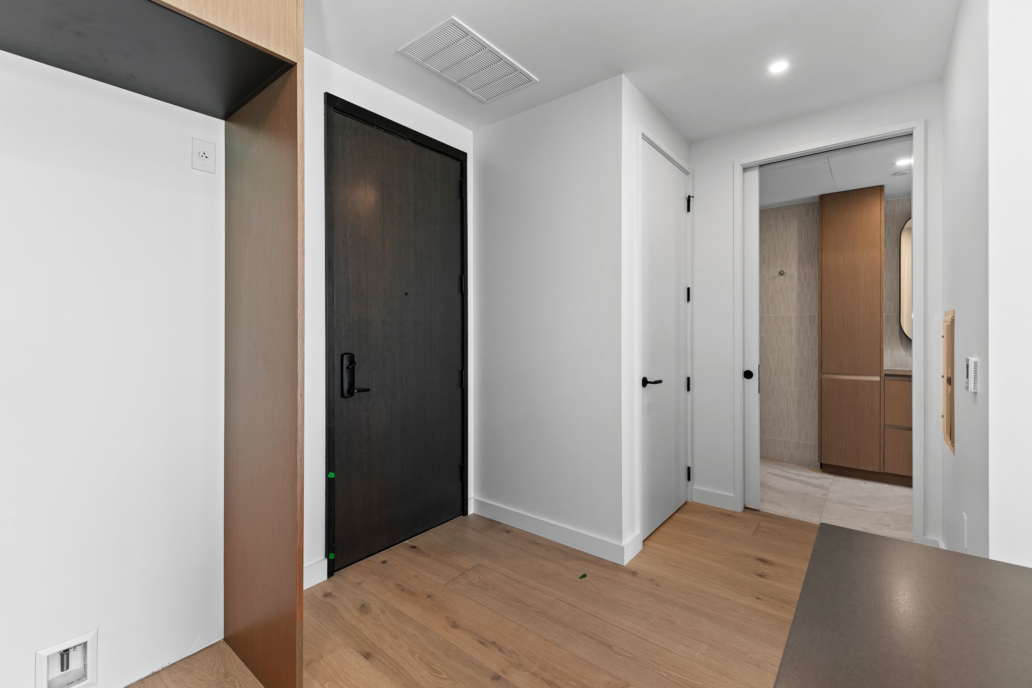 610 Davis Street, Unit 5206 Austin, TX 78701 - Photo 7 of 35 a view of hallway with wooden floor