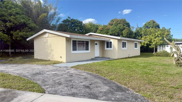 a view of a back yard of the house