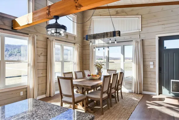 a view of a dining room with furniture window and outside view