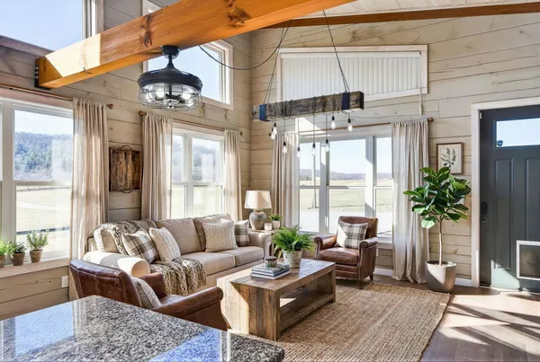 a living room with furniture and a large window