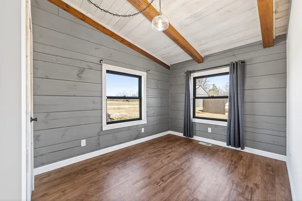 a kitchen with stainless steel appliances a stove refrigerator sink and white cabinets