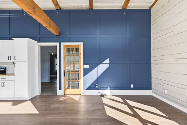 a view of balcony with wooden floor