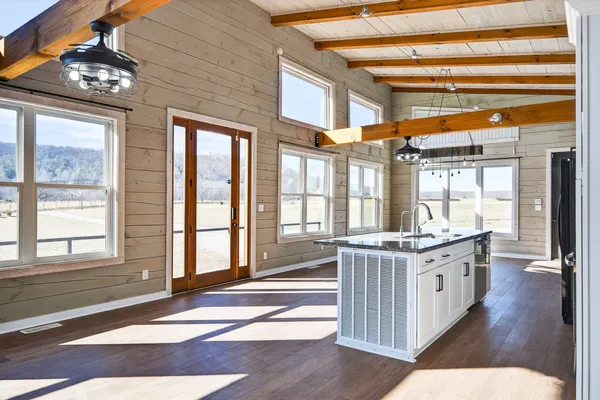 a view of a kitchen with a sink and cabinets