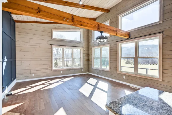 a view of a living room with a large window
