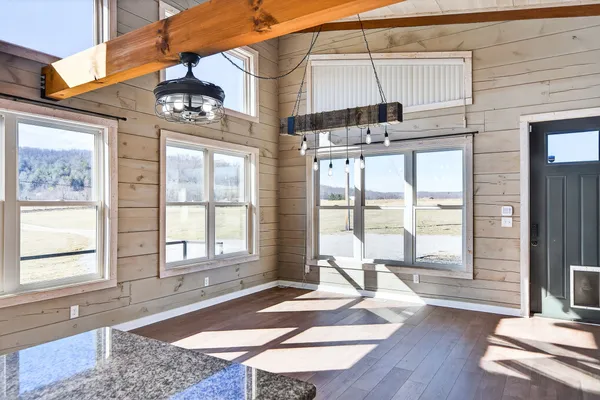 a kitchen with stainless steel appliances granite countertop a refrigerator and a stove