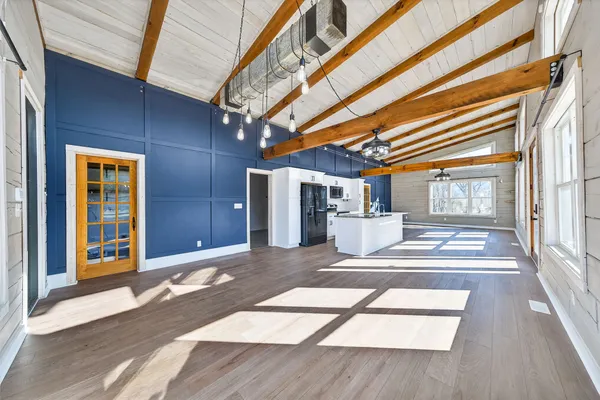 a view of a yard with trees in the background