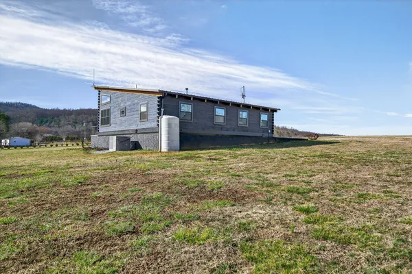 a view of a backyard of the house