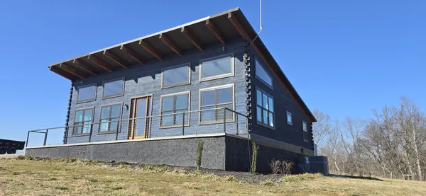 a view of house with roof yard