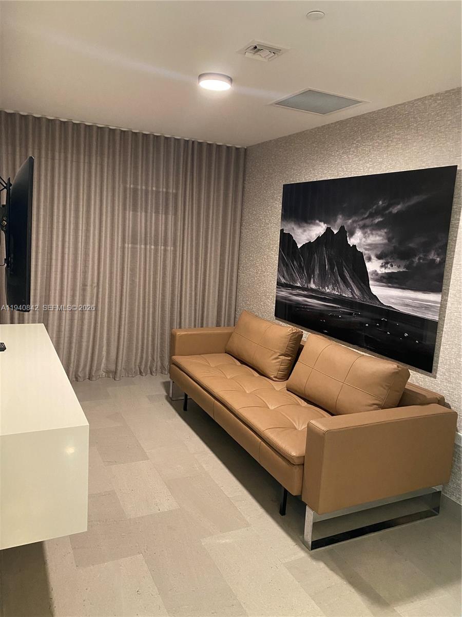 88 Southwest 7th Street, Unit 1904 Miami, FL 33130 - Photo 16 of 33 a living room with furniture and a couch