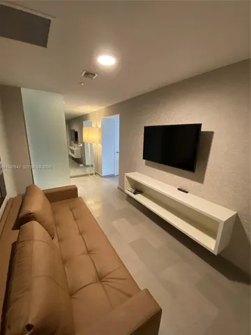 a living room with a couch and a flat screen tv